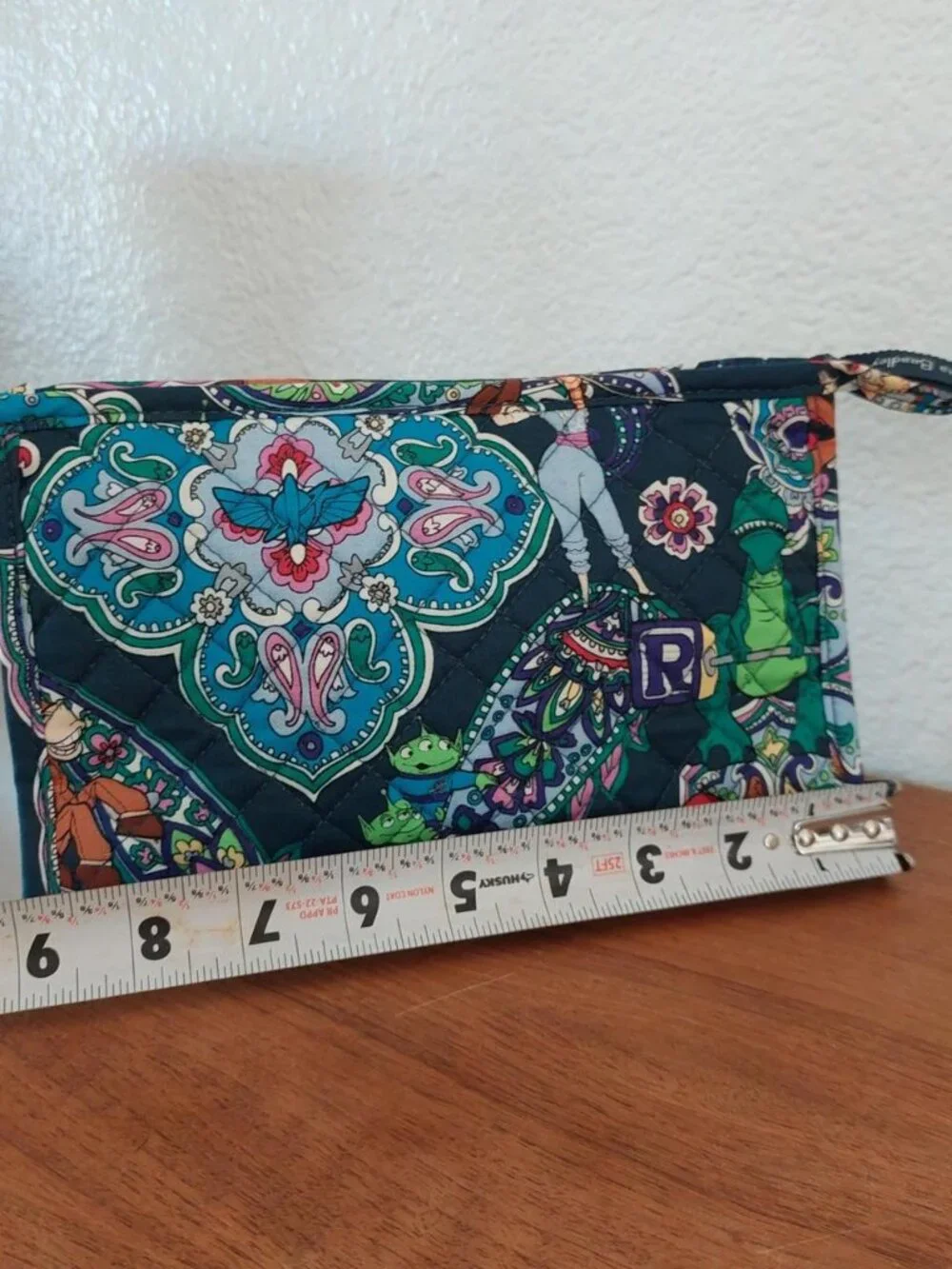 vera bradley Disney Pixar Toy Story quilted pouch with green dinosaur graphic an